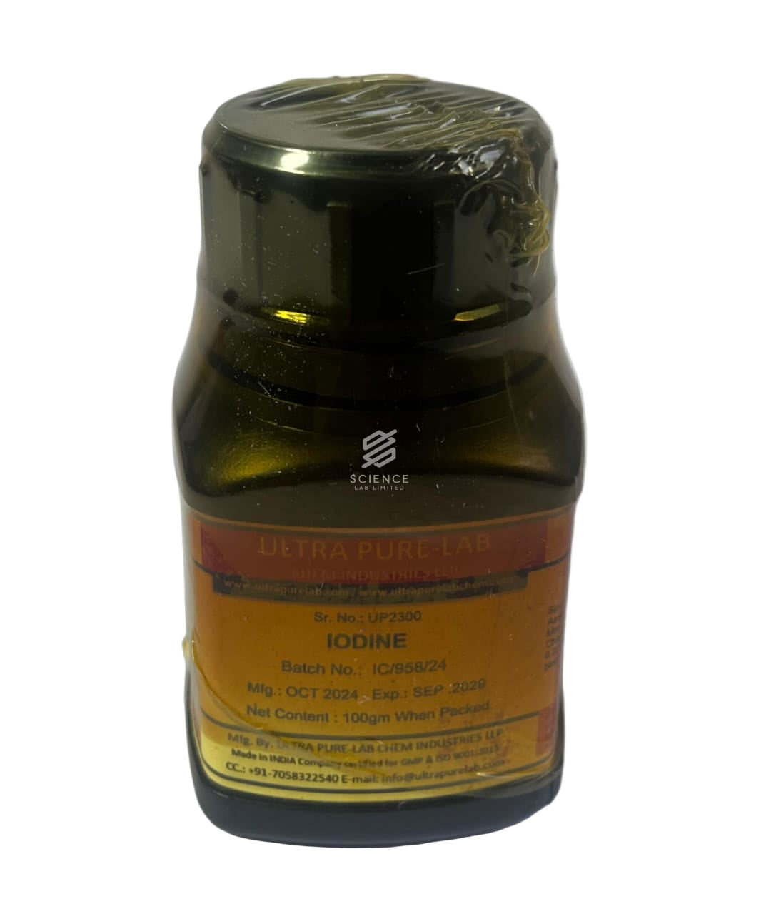 A bottle labeled Iodine crystals, showing a dark-colored container with a yellow label.